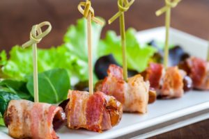 Multiple dates and bacon skewers.